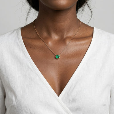 emerald birthstone necklace in rose gold finish — model view