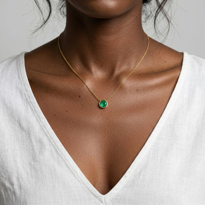 emerald birthstone necklace in yellow gold finish — model view