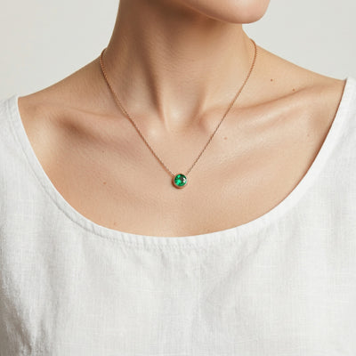 emerald birthstone necklace in rose gold finish — model view