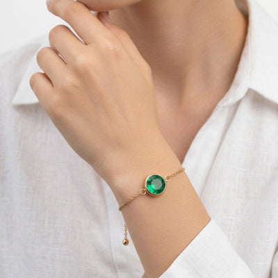 emerald birthstone bracelet in yellow gold finish — model view