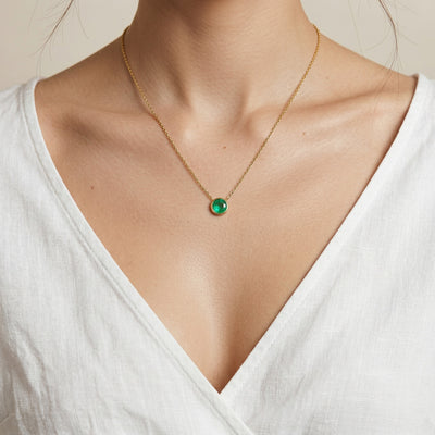 emerald birthstone necklace in yellow gold finish — model view