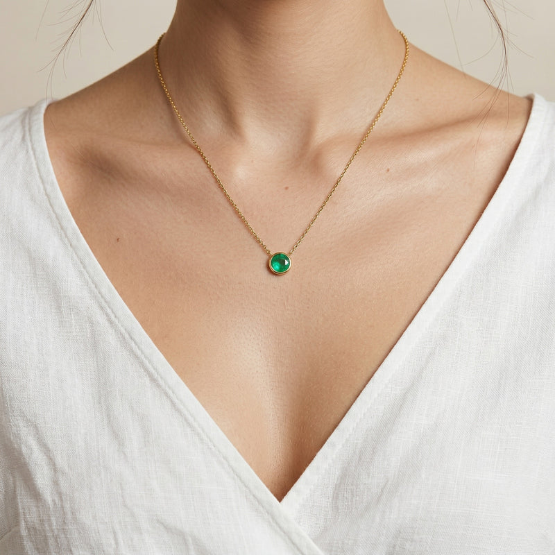 emerald birthstone necklace in yellow gold finish — model view