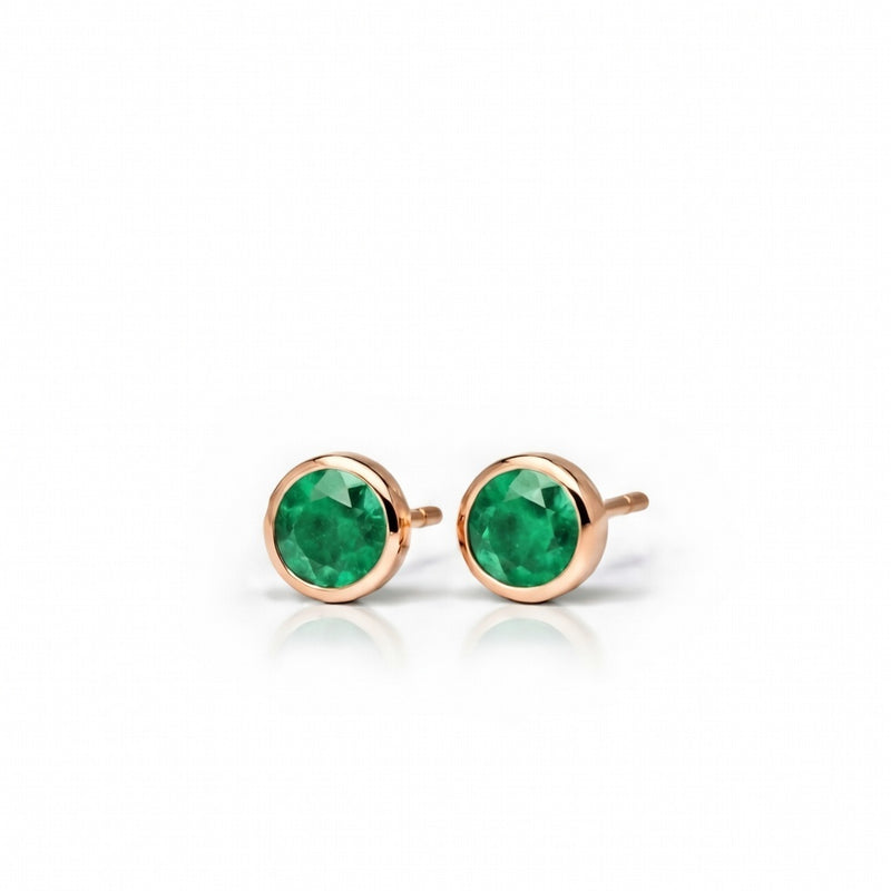emerald birthstone stud earrings in rose gold finish — side view
