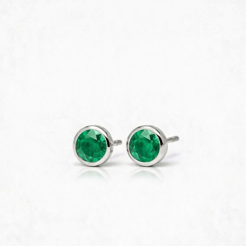 emerald birthstone stud earrings in white gold finish — side view