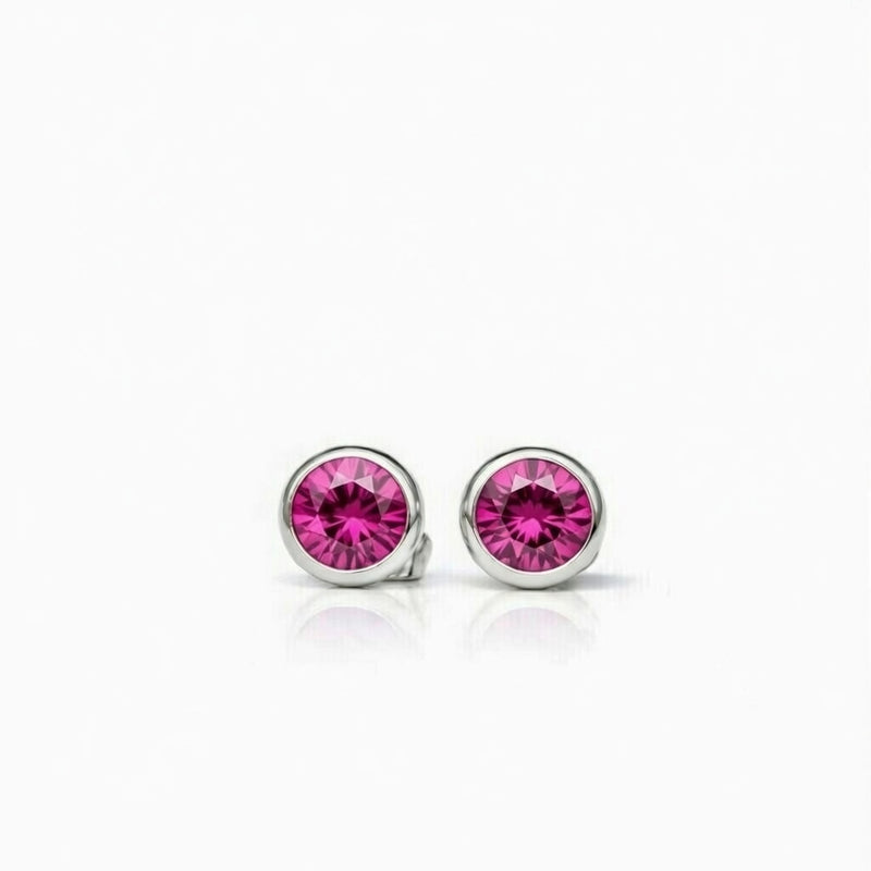 ruby birthstone stud earrings in white gold finish — front view