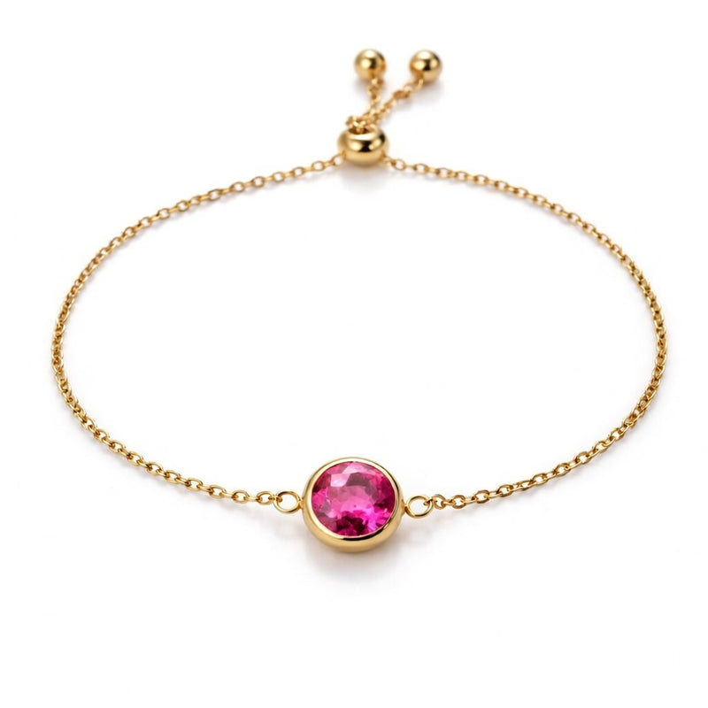 ruby birthstone bracelet in yellow gold finish — front view