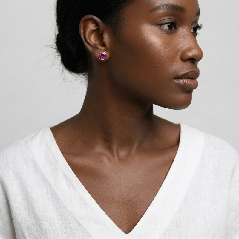 ruby birthstone stud earrings in rose gold finish — model view