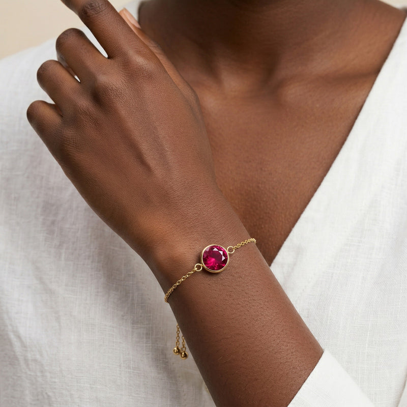 ruby birthstone bracelet in yellow gold finish — model view