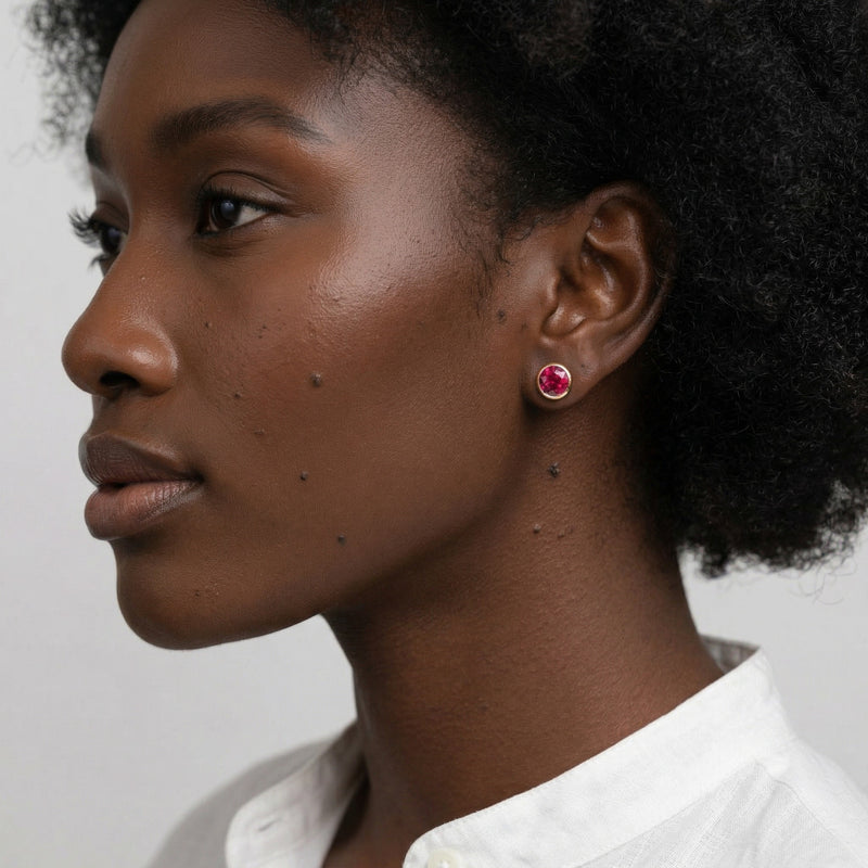 ruby birthstone stud earrings in yellow gold finish — model view