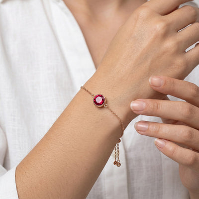 ruby birthstone bracelet in rose gold finish — model view