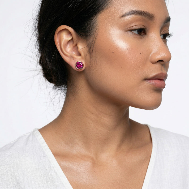 ruby birthstone stud earrings in rose gold finish — model view