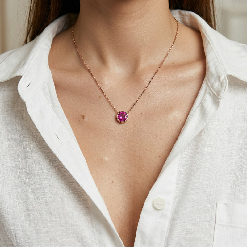 ruby birthstone necklace in rose gold finish — model view