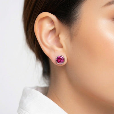 ruby birthstone stud earrings in white gold finish — model view