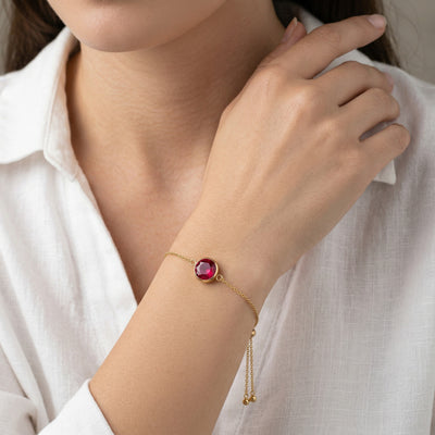 ruby birthstone bracelet in yellow gold finish — model view