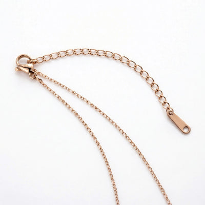 peridot birthstone necklace in rose gold finish — back view