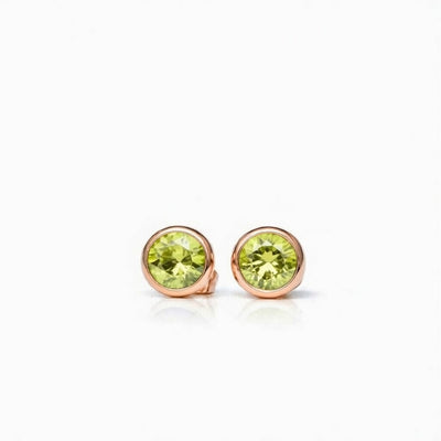peridot birthstone stud earrings in rose gold finish — front view