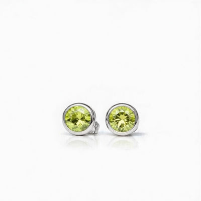 peridot birthstone stud earrings in white gold finish — front view