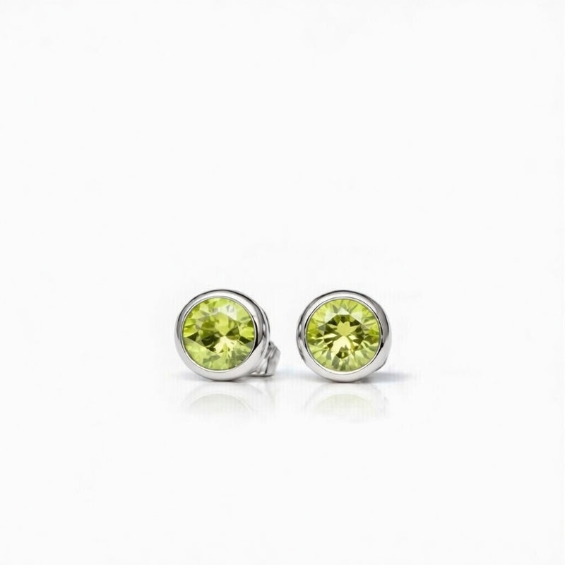 peridot birthstone stud earrings in white gold finish — front view
