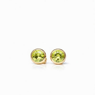 peridot birthstone stud earrings in yellow gold finish — front view