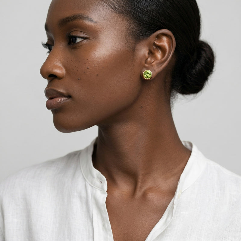 peridot birthstone stud earrings in rose gold finish — model view