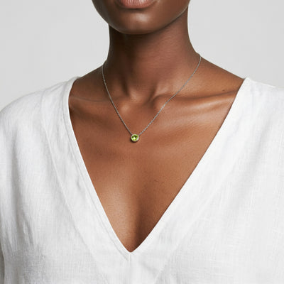 peridot birthstone necklace in white gold finish — model view
