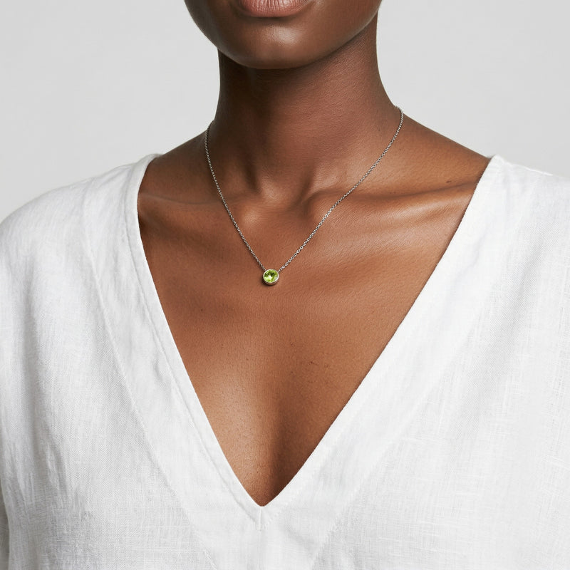 peridot birthstone necklace in white gold finish — model view
