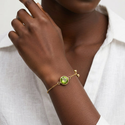 peridot birthstone bracelet in yellow gold finish — model view