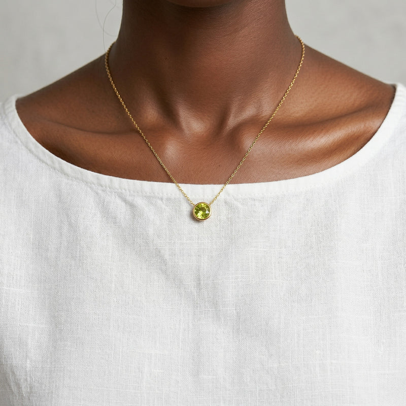 peridot birthstone necklace in yellow gold finish — model view