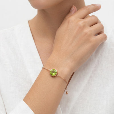 peridot birthstone bracelet in rose gold finish — model view