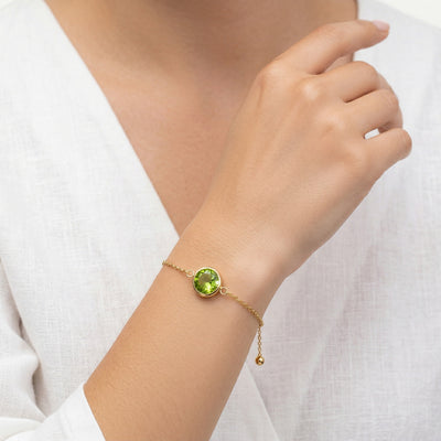 peridot birthstone bracelet in yellow gold finish — model view