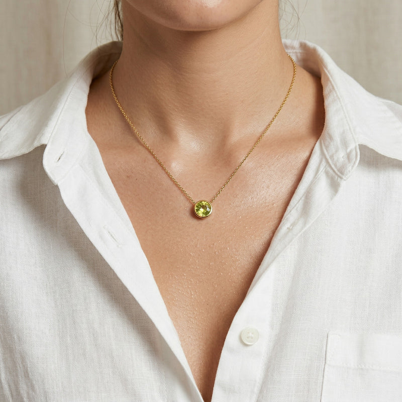 peridot birthstone necklace in yellow gold finish — model view
