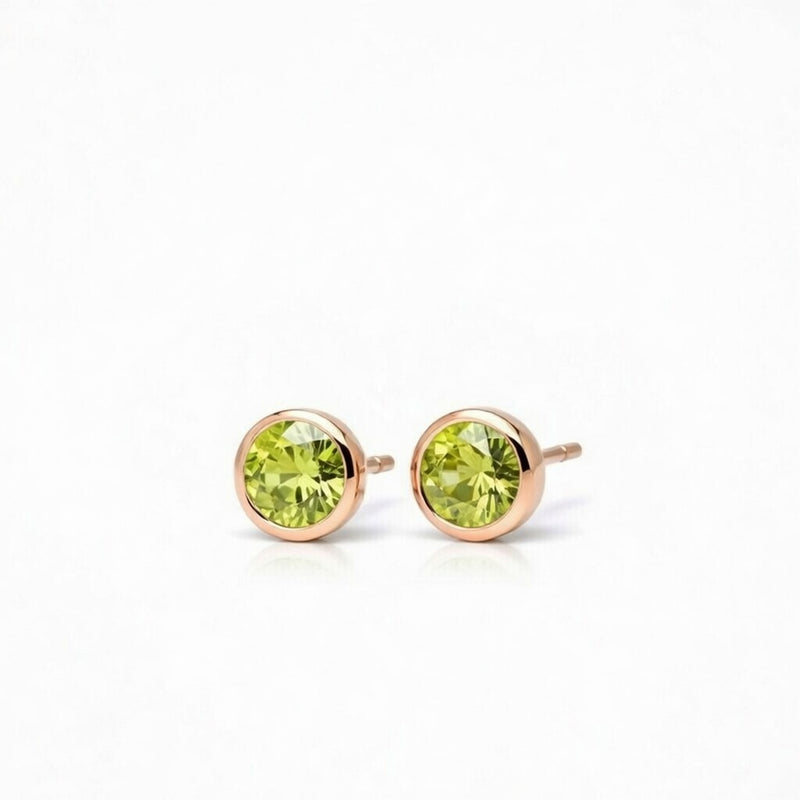 peridot birthstone stud earrings in rose gold finish — side view
