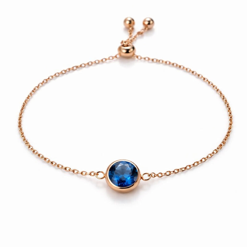 sapphire birthstone bracelet in rose gold finish — front view