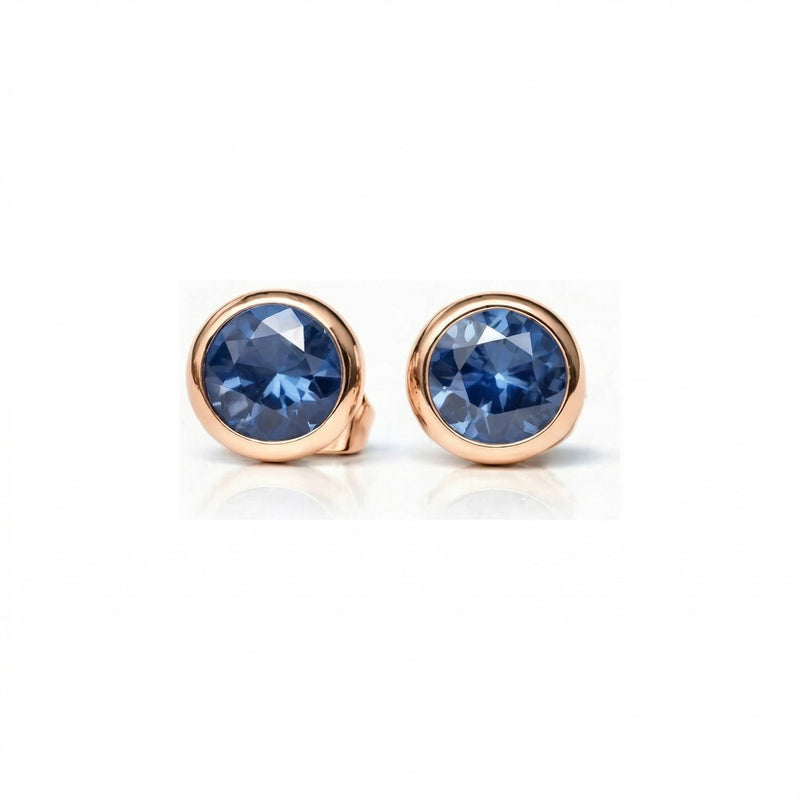 sapphire birthstone stud earrings in rose gold finish — front view
