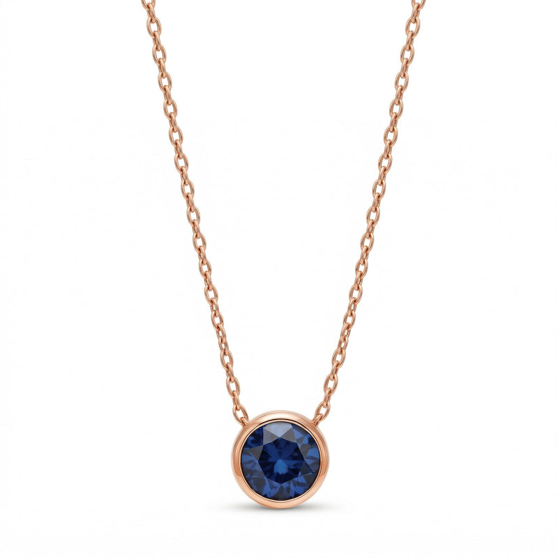 sapphire birthstone necklace in rose gold finish — front view