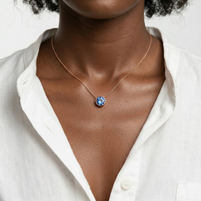 sapphire birthstone necklace in rose gold finish — model view