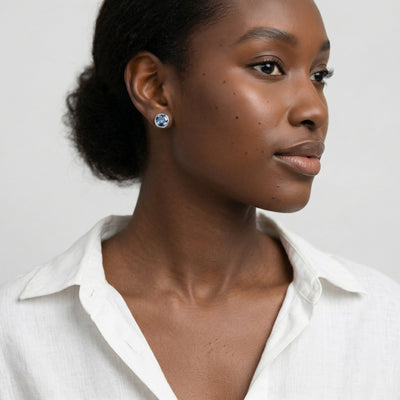 sapphire birthstone stud earrings in white gold finish — model view