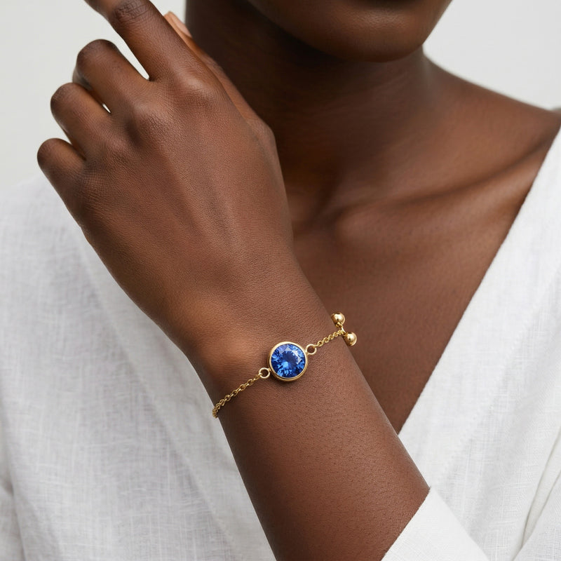 sapphire birthstone bracelet in yellow gold finish — model view