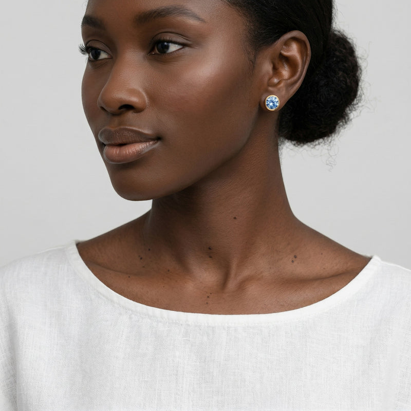 sapphire birthstone stud earrings in yellow gold finish — model view