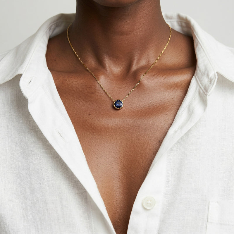 sapphire birthstone necklace in yellow gold finish — model view