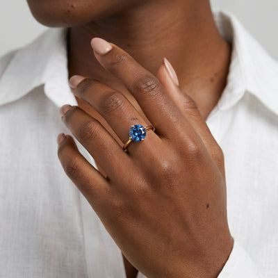 sapphire birthstone ring in yellow gold finish — model view