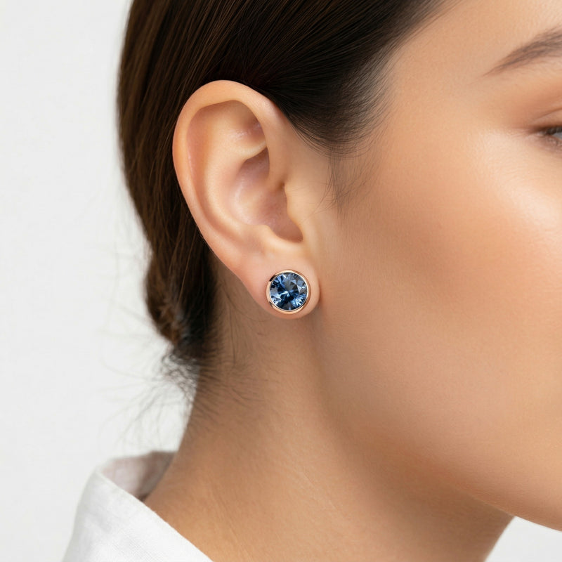 sapphire birthstone stud earrings in rose gold finish — model view