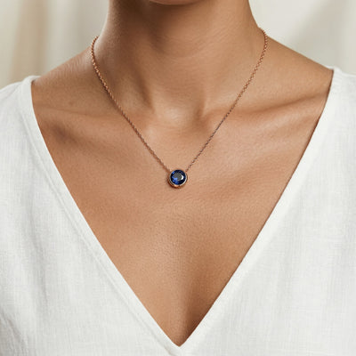 sapphire birthstone necklace in rose gold finish — model view