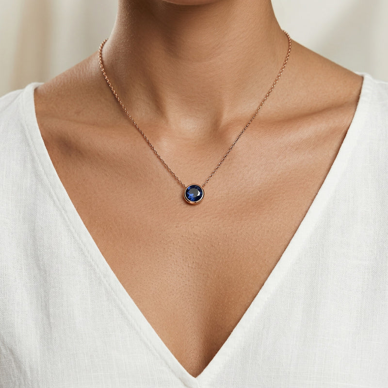 sapphire birthstone necklace in rose gold finish — model view