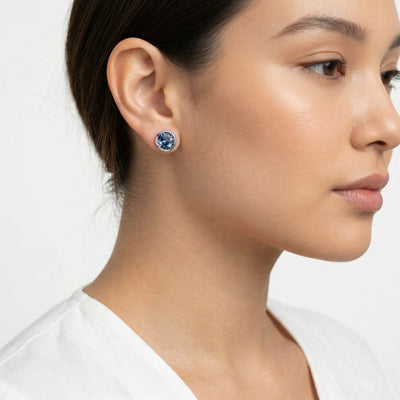 sapphire birthstone stud earrings in white gold finish — model view