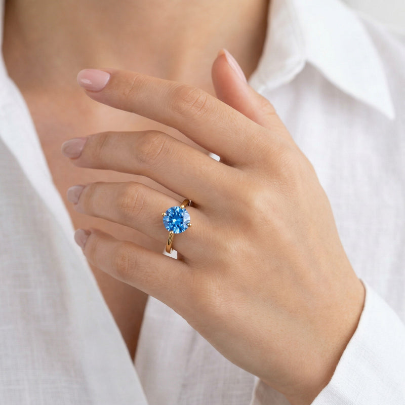 sapphire birthstone ring in yellow gold finish — model view