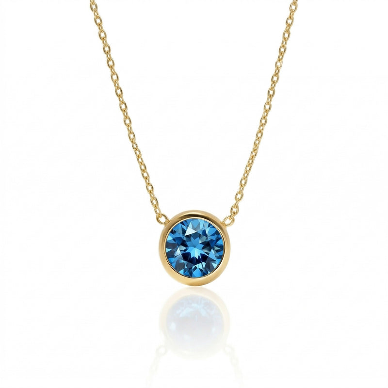 blue topaz birthstone necklace in yellow gold finish — front view