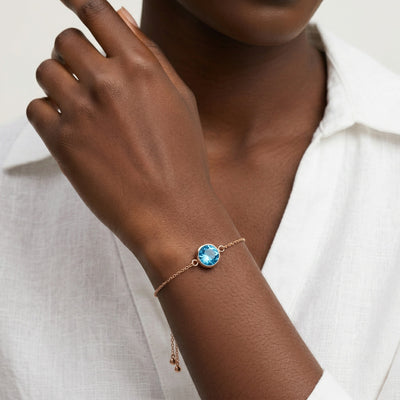 blue topaz birthstone bracelet in rose gold finish — model view