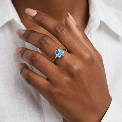 blue topaz birthstone ring in rose gold finish — model view