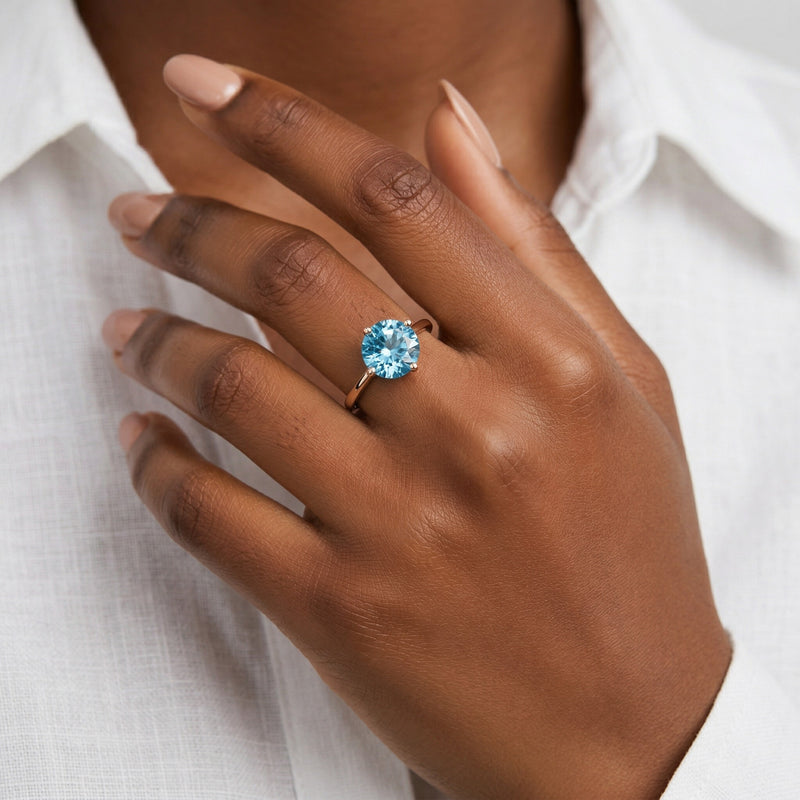 blue topaz birthstone ring in rose gold finish — model view